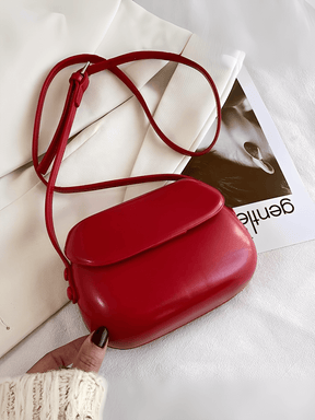 Bolsa Feminina em Couro PU com Design Arredondado e Alça Regulável – Odete